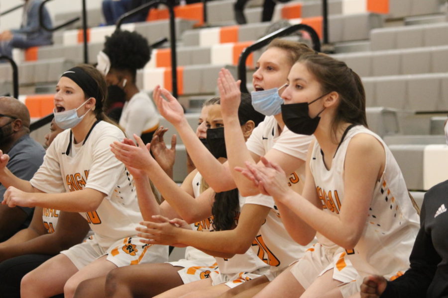 Kenzie%2C+Bella+M.%2C+Jenna%2C+Bella+L.%2C+Lilly+cheering+on+their+team+after+a+fast+break+layup.%0APhoto+by+Elisa+Candleana