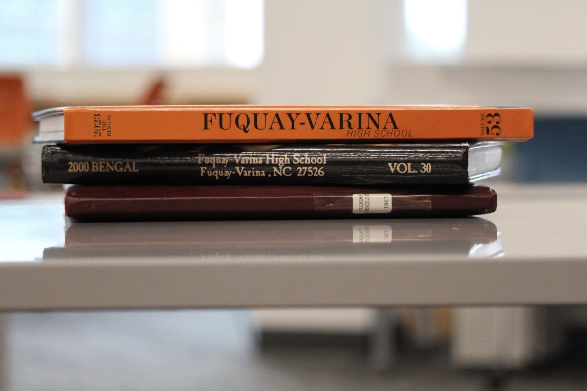 Fuquay-Varina High School yearbooks from 2023, 2000, and 1967.