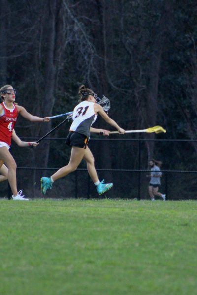 Sophomore Sydney Remmer takes a shot on the goal versus Sanderson High School.