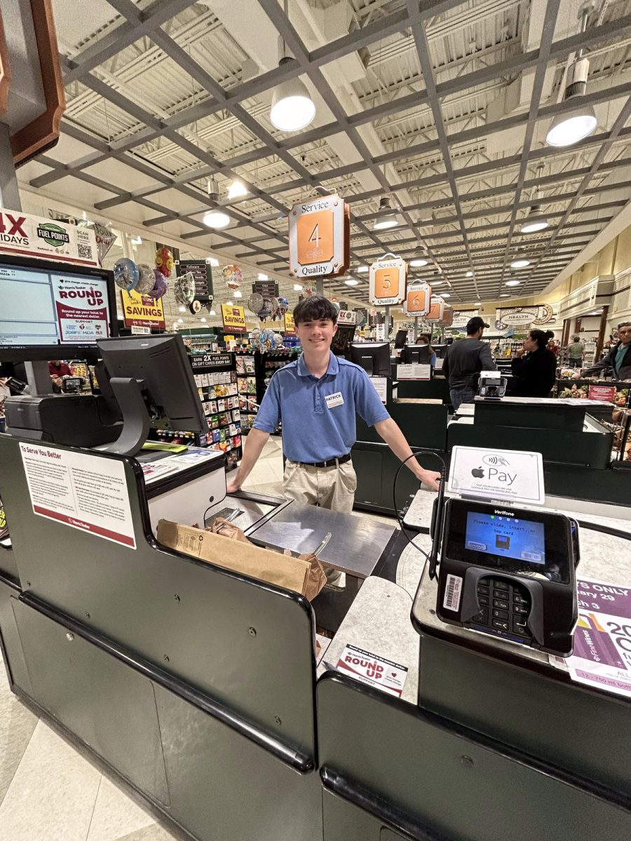 Senior Patrick Eckert works as a cashier at Harris Teeter after school.