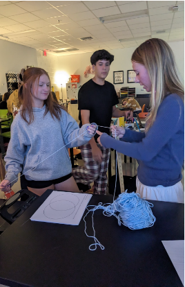 MacKenna Silver, Micheal Ruggiero, Dorothy Dunning work on a project in science teacher Trista Schoop’s class. 