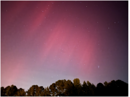 The sky shines with colors as the northern lights are able to be seen in the Carolinas 
