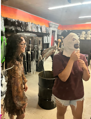 Bella Mondelli and Kensy Amaya shop for costumes at Spirit Halloween.