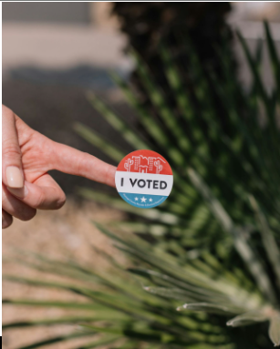 People are getting "I voted" stickers for their participation in democracy. 