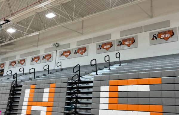 State championship banners hang in the gym, showing our schools history of sports accomplishments.