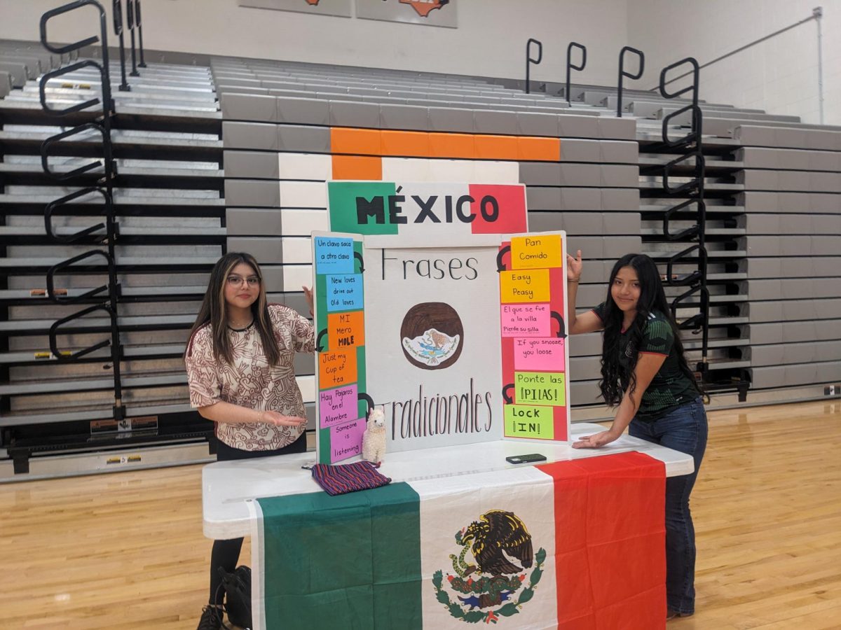 Ashley Morales-Lopez and Ciara George present one of the mexico booths for culture day fair