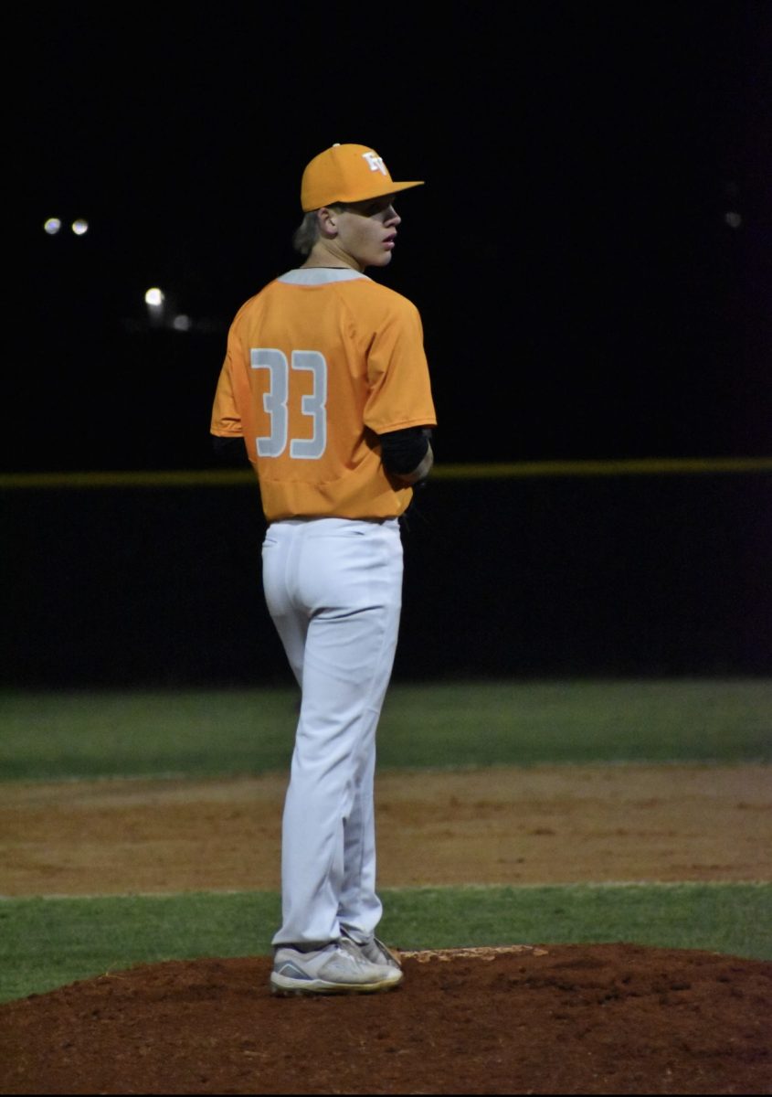 Sophomore Parker Garrett preparing to pitch. 

