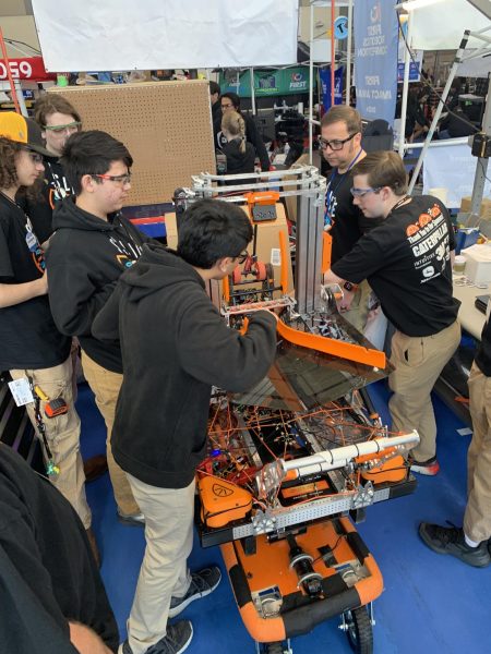 Students work together to build their robot. 