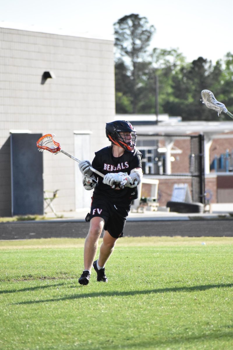 Connor Castle winds up for a pass during a match against Apex Friendship High.

