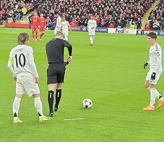 Liverpool plays Tottenham at Anfield during their championship winning season.


