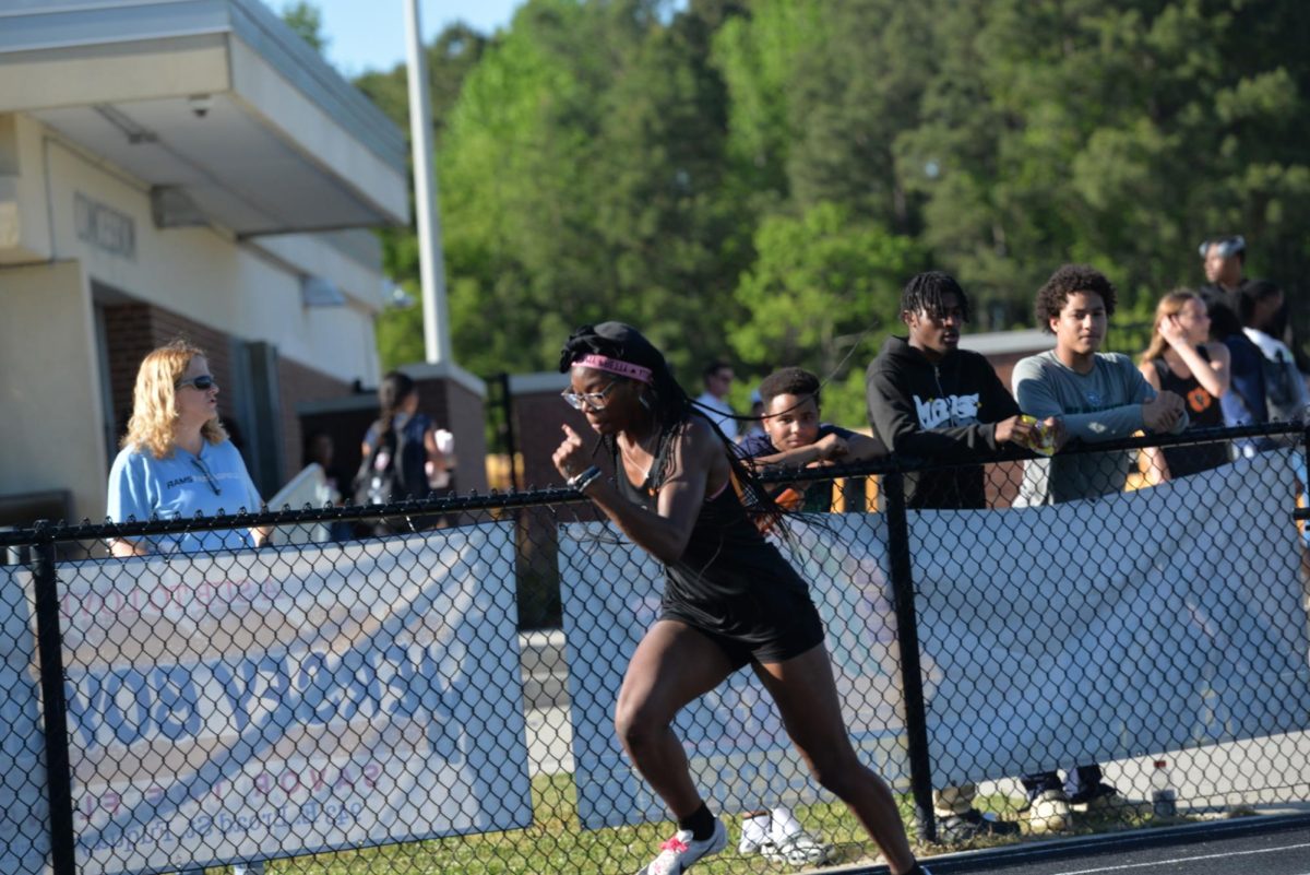 Junior Amirrah McFarland runs in a track meet.
