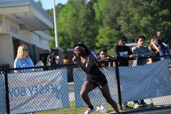 Junior Amirrah McFarland runs in a track meet.