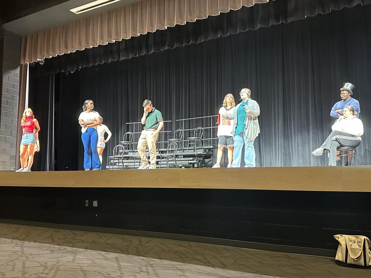 Students (left to right) Sophia Matthews, Maimouna Diallo, Ivy Reeves, Brady Starler, Savannah Kurtz, Amelia Fruend, Jakeem Stewart, and Izzy McFalls work on their One Act “Gee!”