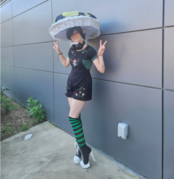 Katie Meuse prepares for the club fair in her mushroom cosplay.