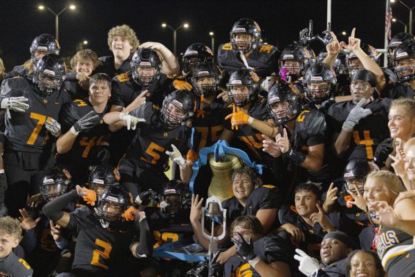 The Fuquay-Varina Bengals celebrate winning the Victory Bell after defeating rival Willow 20-7 on Friday night. It’s the first win in three years, capping a dominant performance fueled by strong defense, key turnovers, and unstoppable team energy.