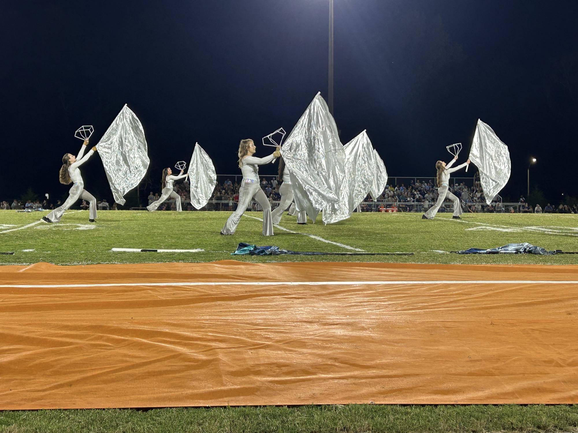 Color guard performs at halftime on a Friday night FVHS home game.