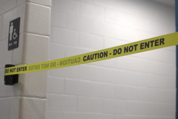The bathroom outside of the theatre room is temporarily shut down with new caution tape.