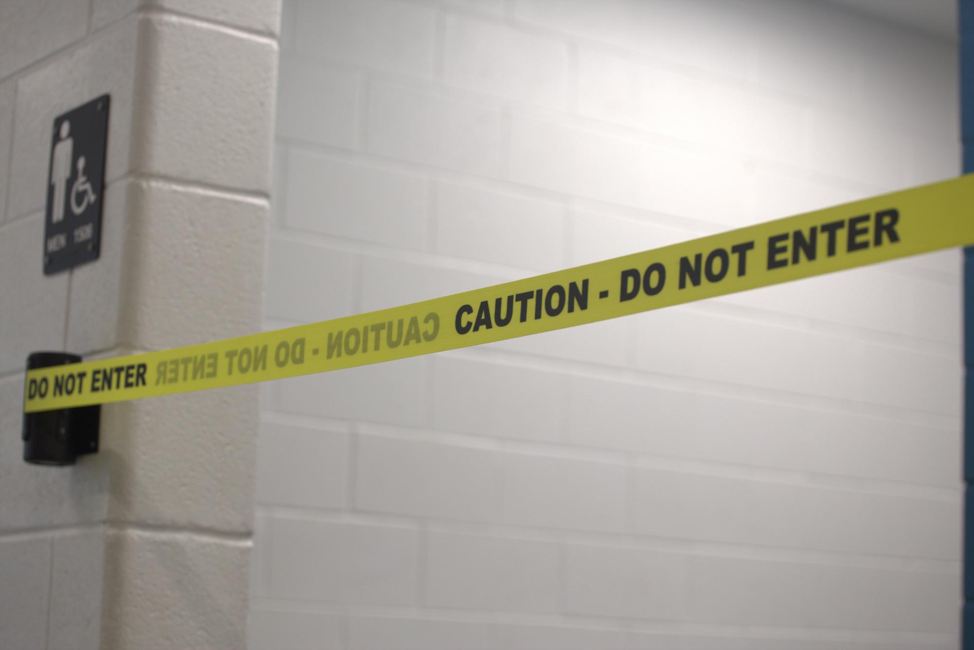 The bathroom outside of the theatre room is temporarily shut down with new caution tape.