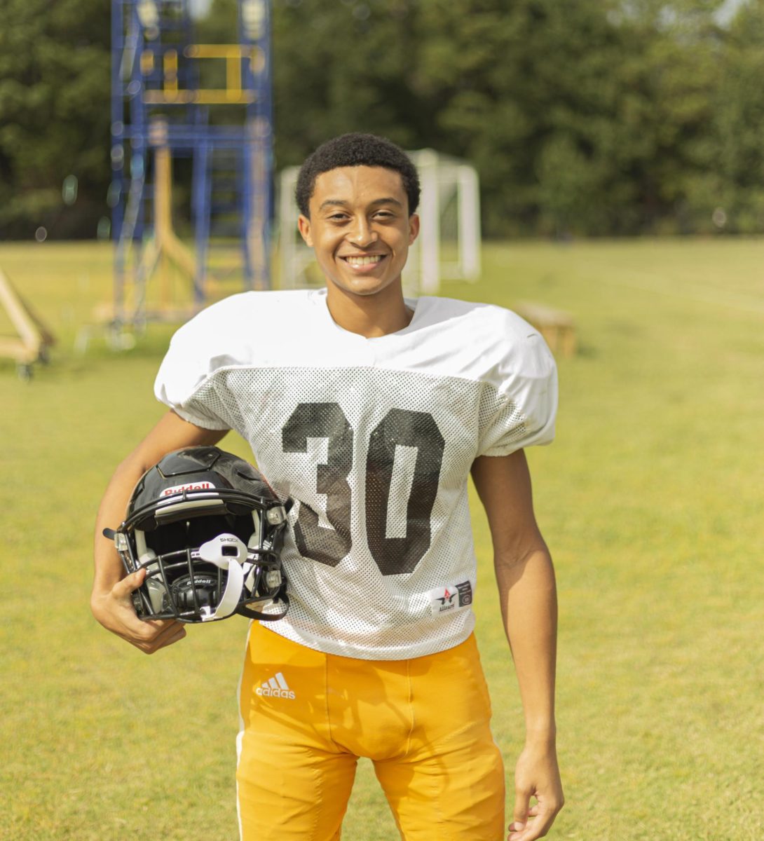Junior Justin Odom showcases his freshly shined helmet before practice. 