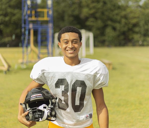Junior Justin Odom showcases his freshly shined helmet before practice. 