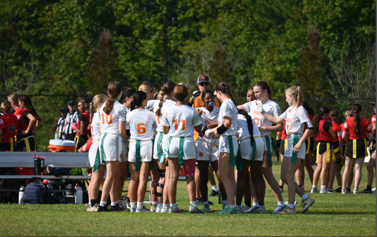 The players talk in their huddle, strategizing together to win their tournament. 