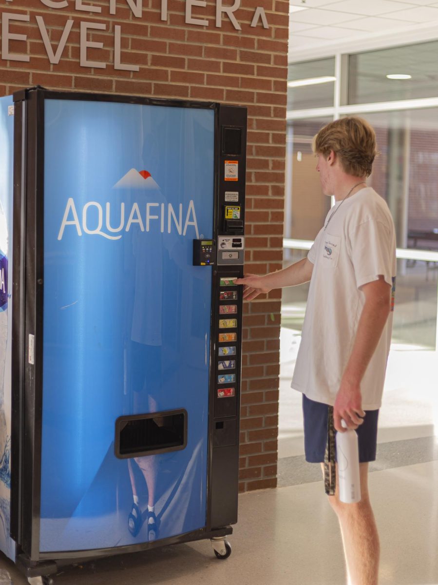 A student using a vending machine in FVHS.