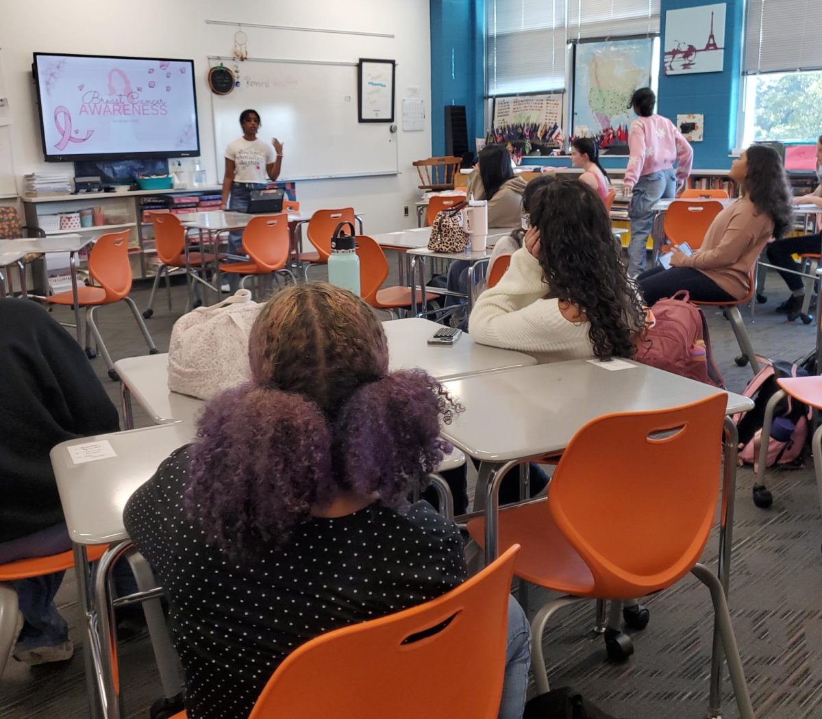 Students come together during a WHOA meeting to help raise awareness for those with breast cancer.
