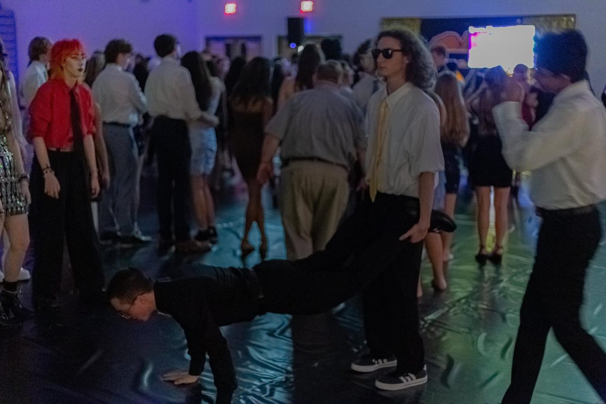 Brady Starler and Ryan Benditz try out a fun dance move at the Homecoming dance.