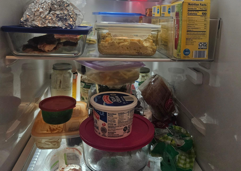 A refrigerator is filled with a variety of foods.