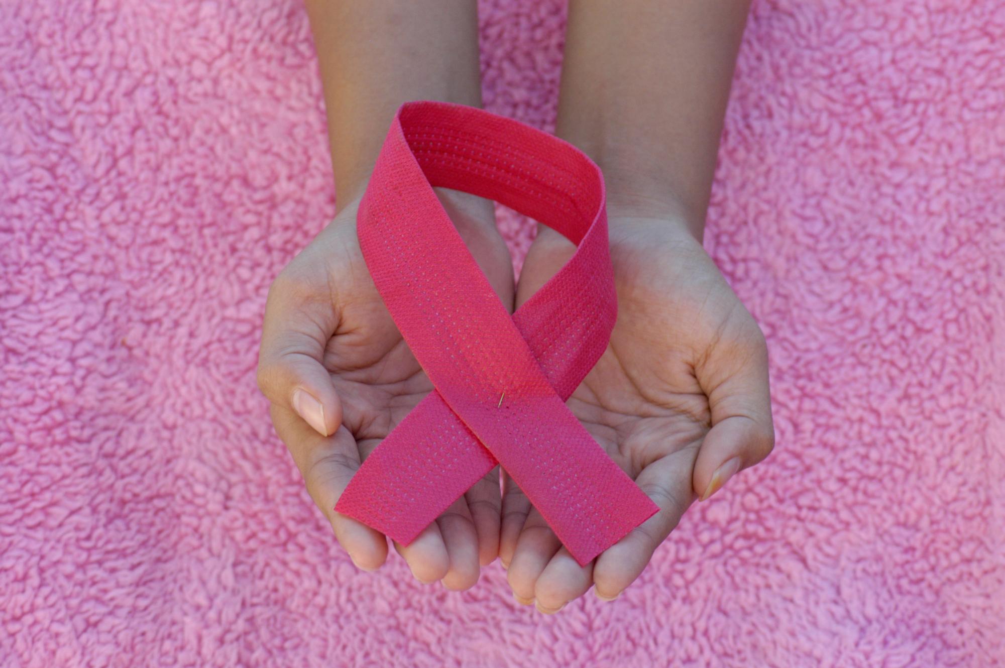 The pink ribbon which is the symbol for Breast Cancer Awareness.
