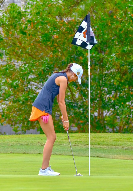 Junior Lydia Feldner lines up a putt on the green, showing focus and determination as the Lady Bengals chase their third straight conference championship