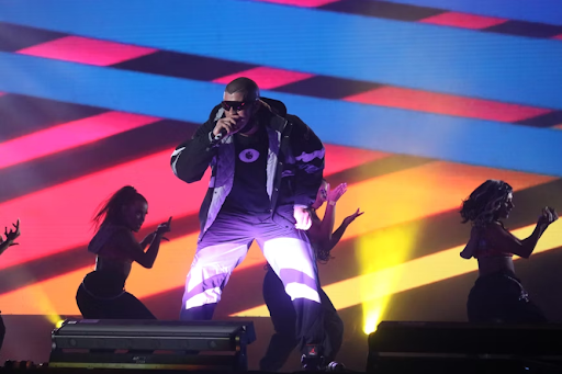Latin singer Bad Bunny performing live on stage.