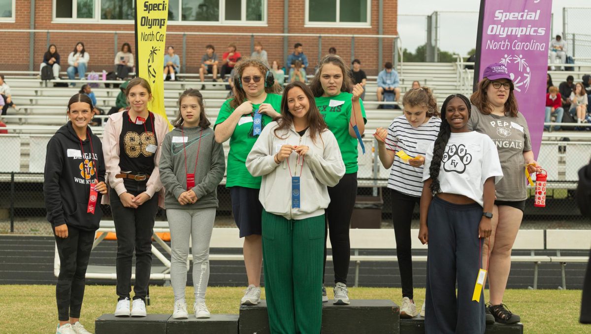 Athletes and their United partners celebrate their efforts on the podium after the events.