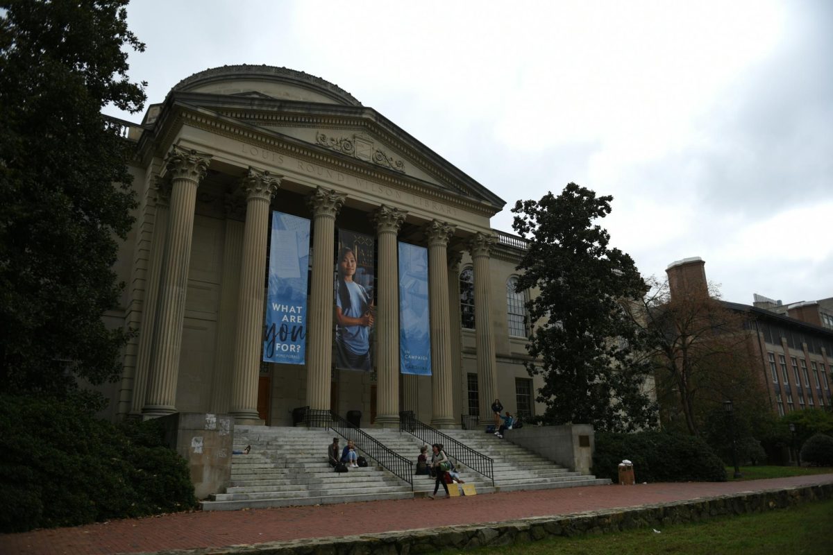 Students at UNC Chapel Hill will need more financial aid after the recent tuition increase. Photo by Colin Rowley on Unsplash.