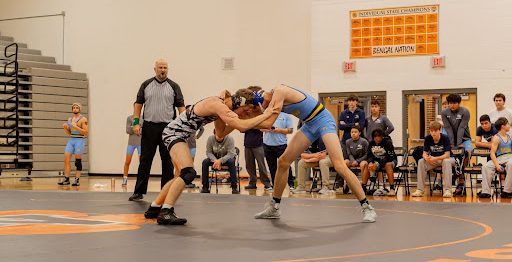 Senior Dominic Austin wrestles in a match against Willow Springs. 