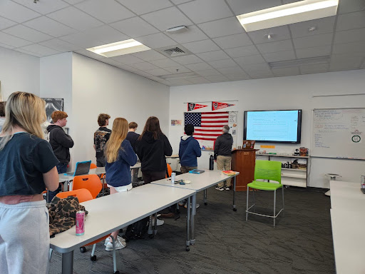 Marshall Wortham’s English class stands for the Pledge of Allegiance. 