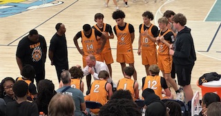 FVHS players huddle up during a timeout, showing the chemistry that has fueled their early 5-1 start.