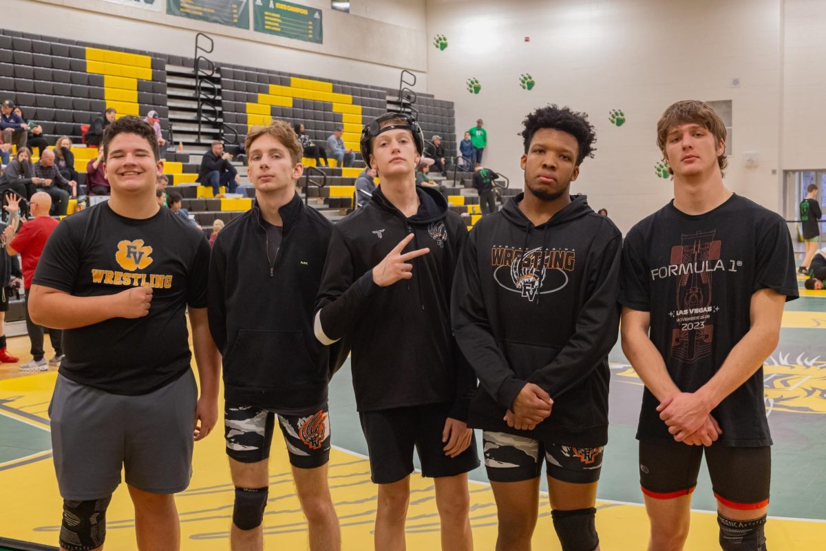 FVHS Men's Wrestling team stands confidently and gets ready to win before they head to the mat.