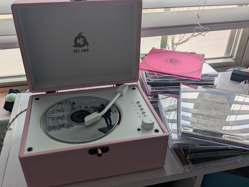 CDs and a CD player are being used instead of a streaming service.  Photo taken by Nathan Yates.