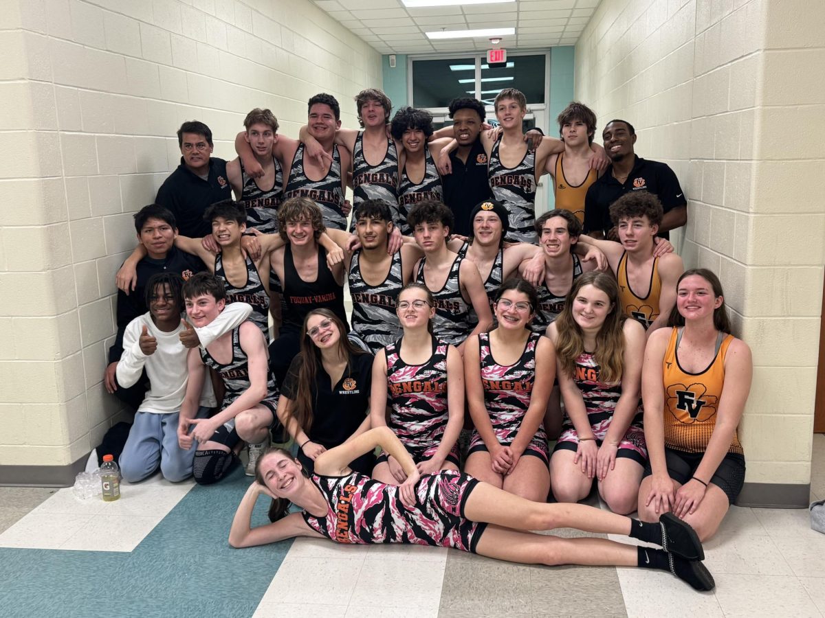 Mens and womens wrestling teams celebrate their wins over South Garner. 