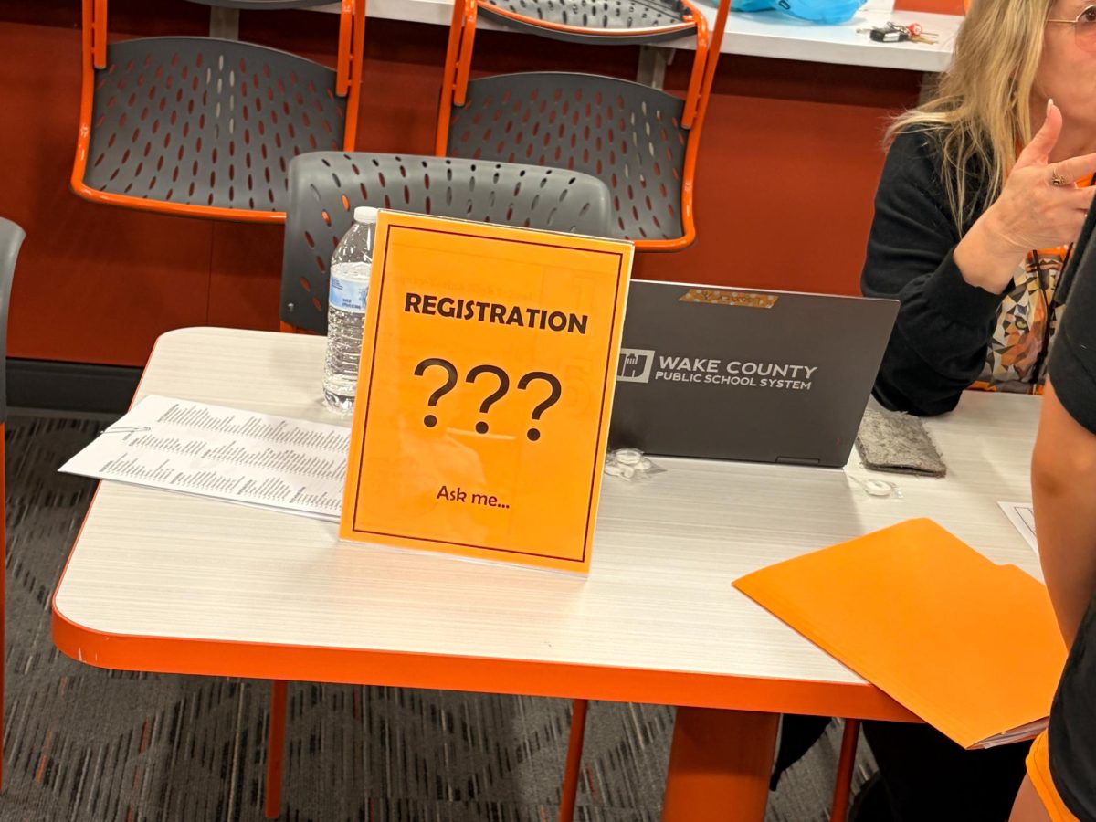 A registration help table at the curriculum fair provided information for students about course selection.