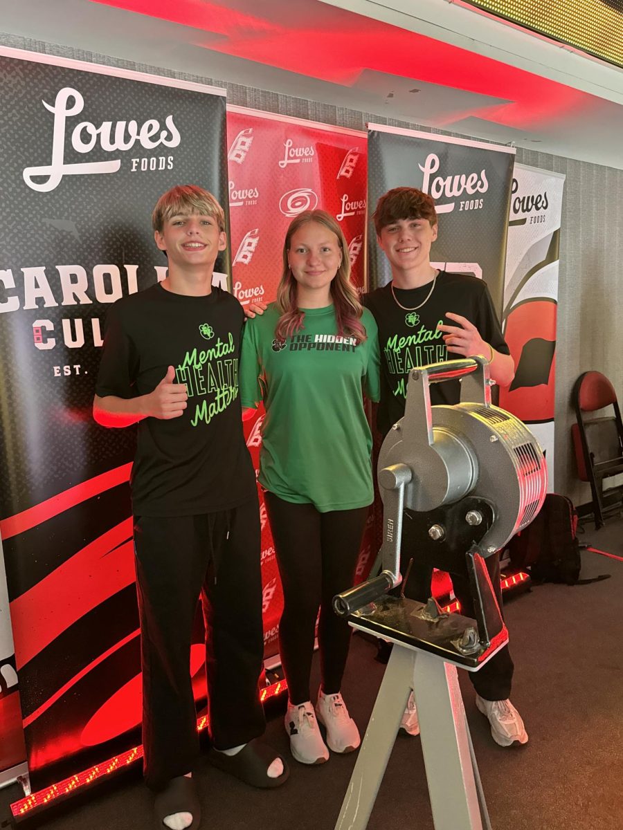 Sophomores Quin Basham, Kenzie Morrison and Gavin Setzer represented THO and sounded the siren at a Carolina Hurricanes game.