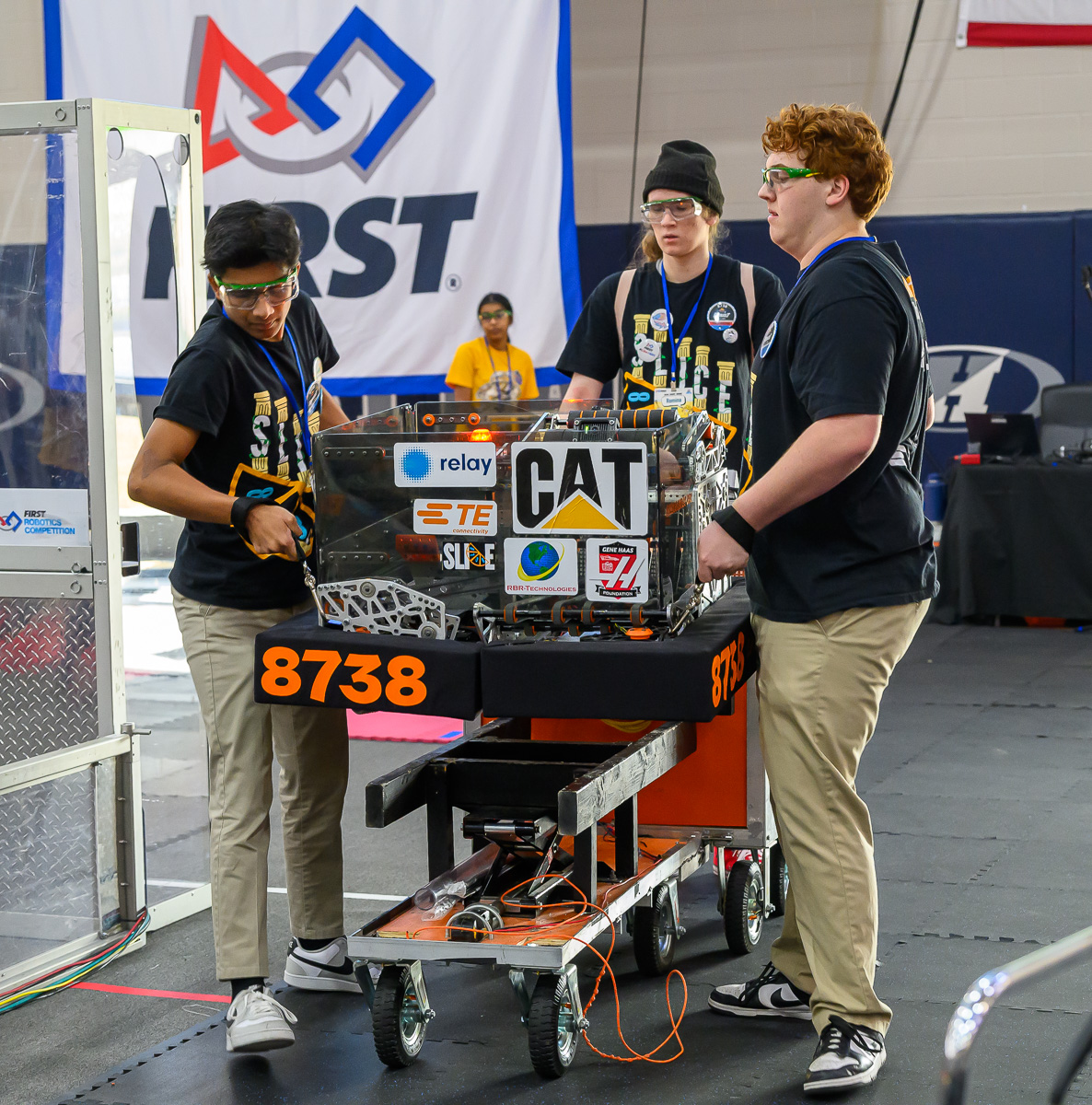 Our SLICE team members prepare the robot for its competition during the second district event.