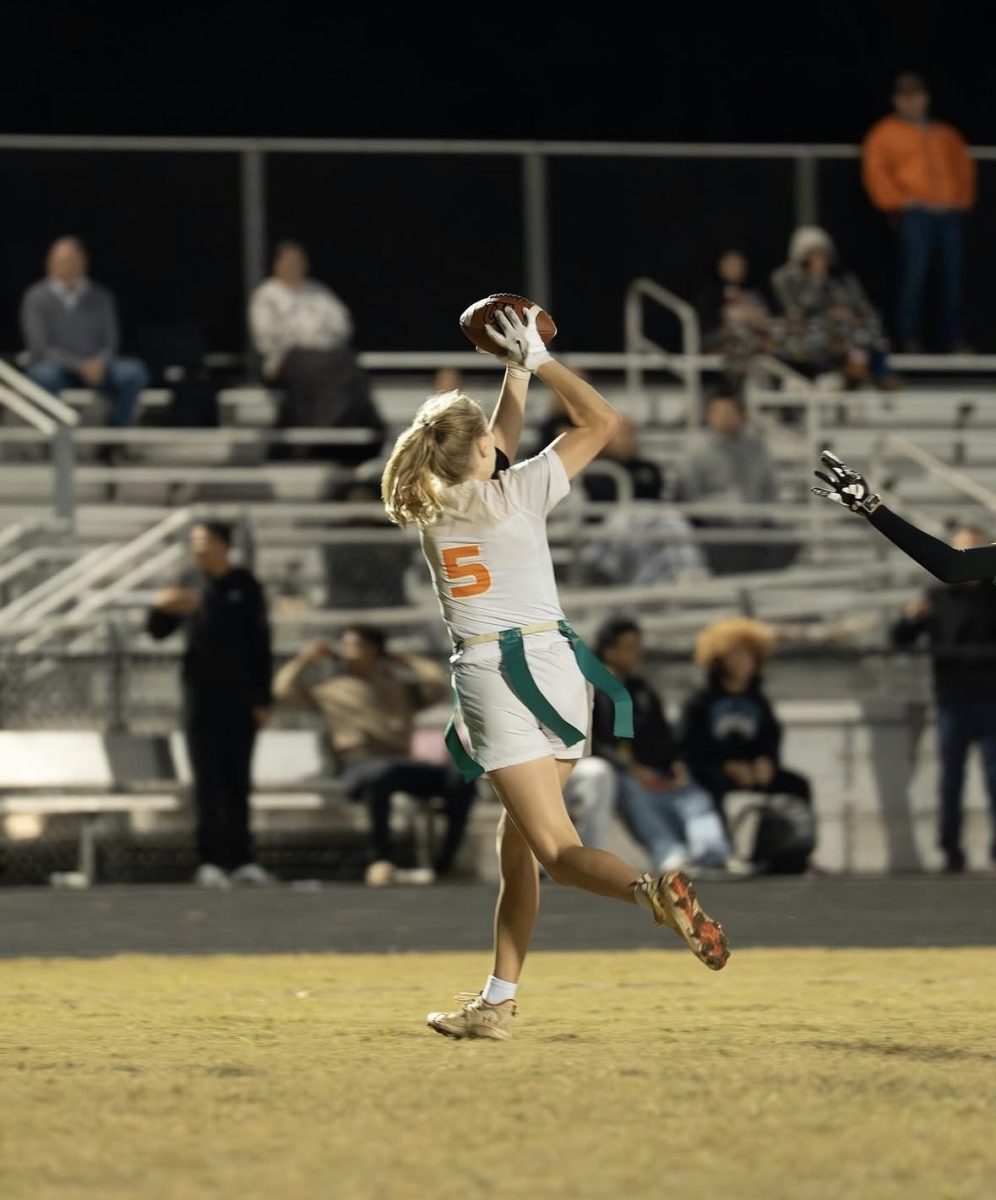 Twins Corbin and Emma Peacock are balancing schoolwork and three different sports, including flag football which Emma plays in the fall.