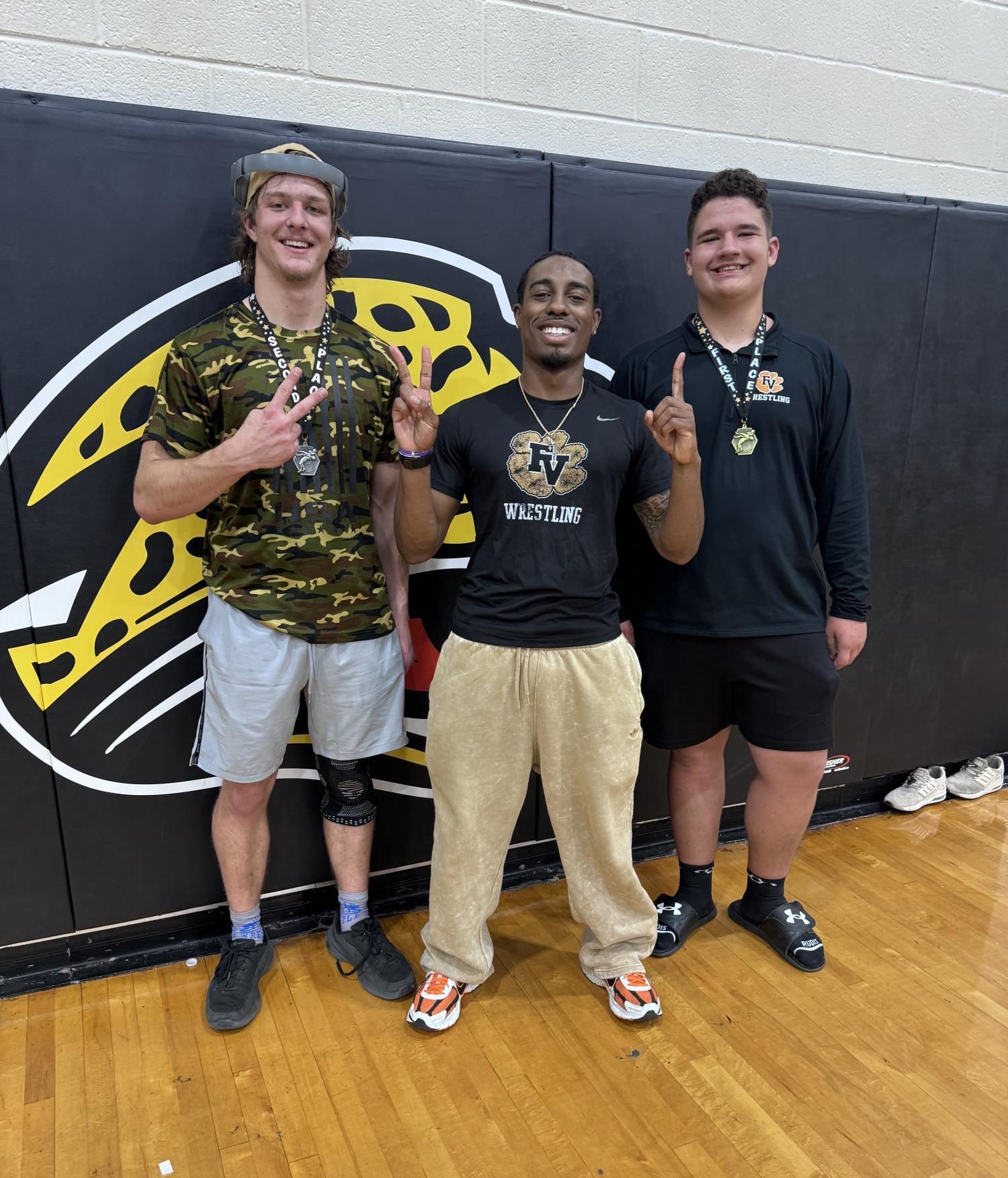 Both men wrestlers dominate the off-season tournament, with most matches ending in pins.