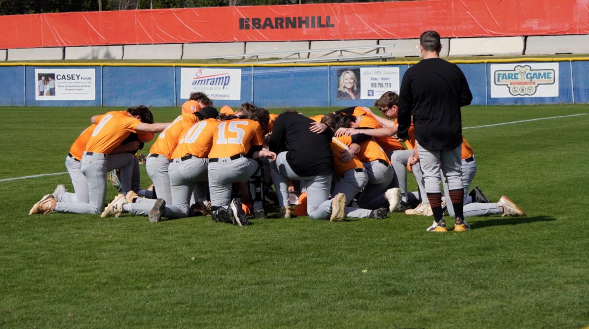 One of the few pregame rituals the JV baseball team does for a good game.