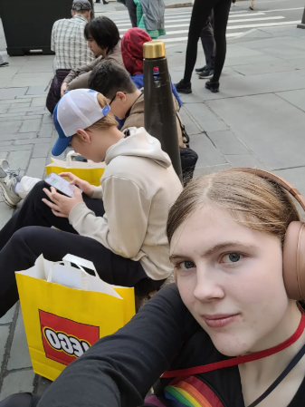 Students on a trip to New York look at their phones instead of the new city they are in.