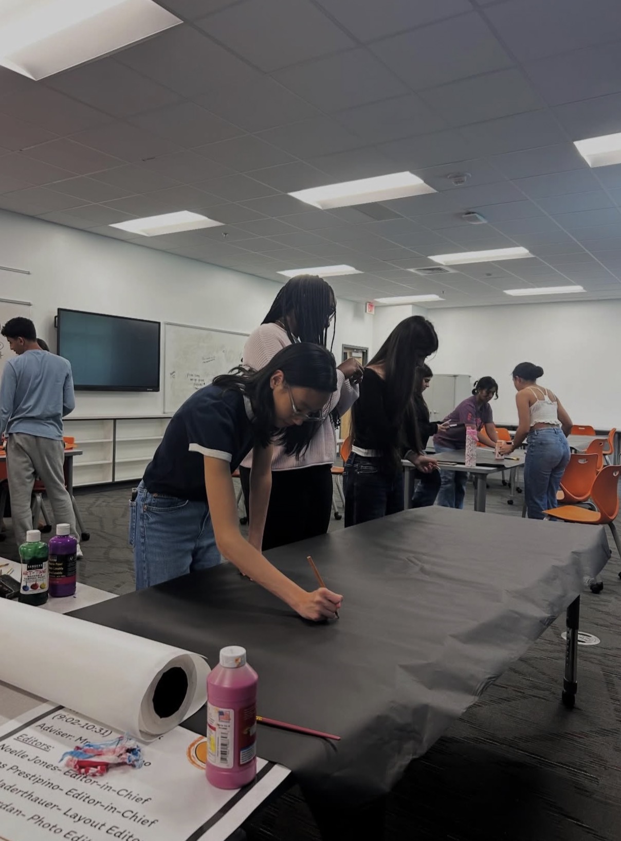Student Council members work together to prepare decorations and materials for the upcoming senior sunset.